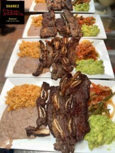 Assorted Salvadoran dishes including handmade pupusas, tamales, fried yuca, and plantains served fresh at Pupusería Patty’s