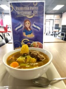 Assorted Salvadoran dishes including handmade pupusas, tamales, fried yuca, and plantains served fresh at Pupusería Patty’s