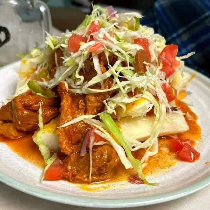 Assorted Salvadoran dishes including handmade pupusas, tamales, fried yuca, and plantains served fresh at Pupusería Patty’s