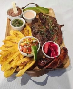 Assorted Salvadoran dishes including handmade pupusas, tamales, fried yuca, and plantains served fresh at Pupusería Patty’s