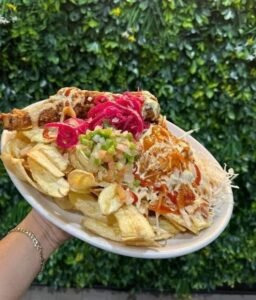 Assorted Salvadoran dishes including handmade pupusas, tamales, fried yuca, and plantains served fresh at Pupusería Patty’s