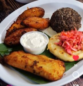 Assorted Salvadoran dishes including handmade pupusas, tamales, fried yuca, and plantains served fresh at Pupusería Patty’s