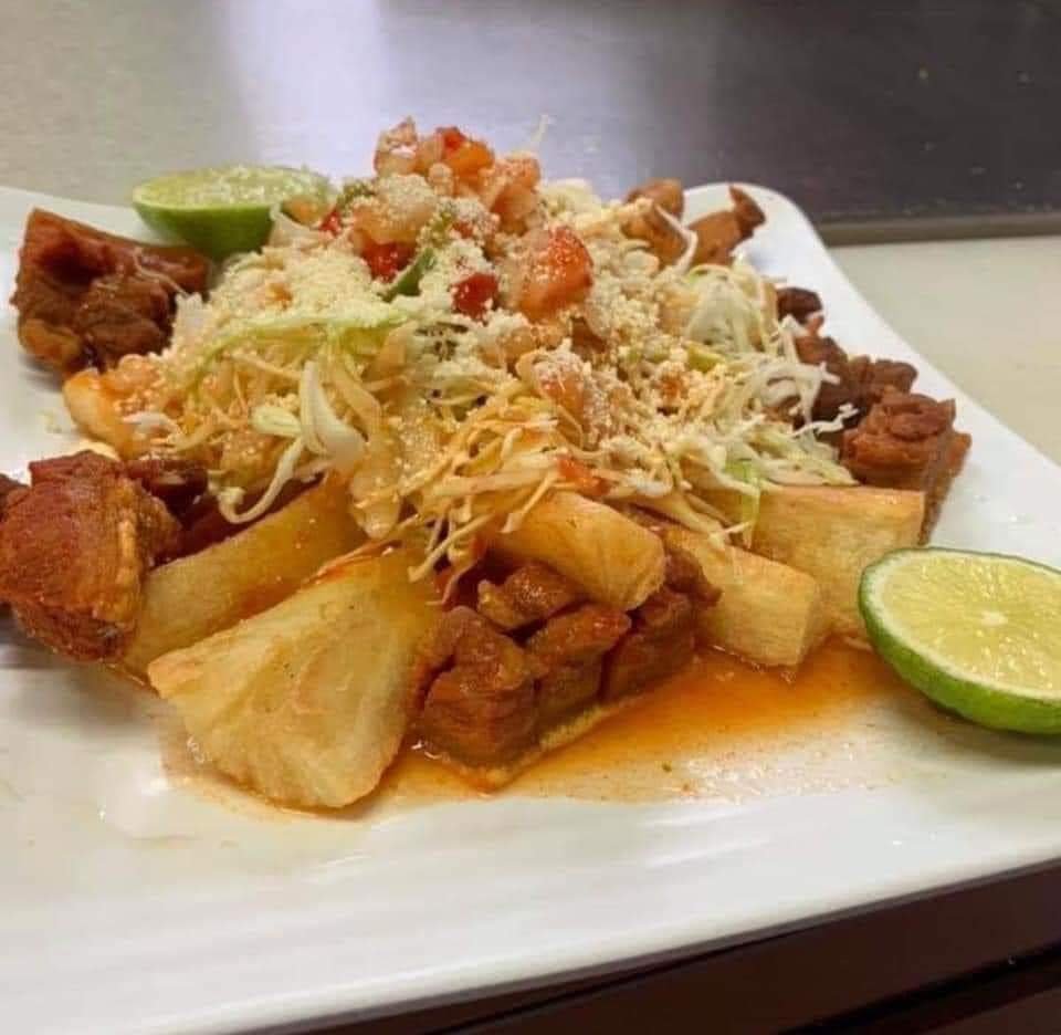 Assorted Salvadoran dishes including handmade pupusas, tamales, fried yuca, and plantains served fresh at Pupusería Patty’s